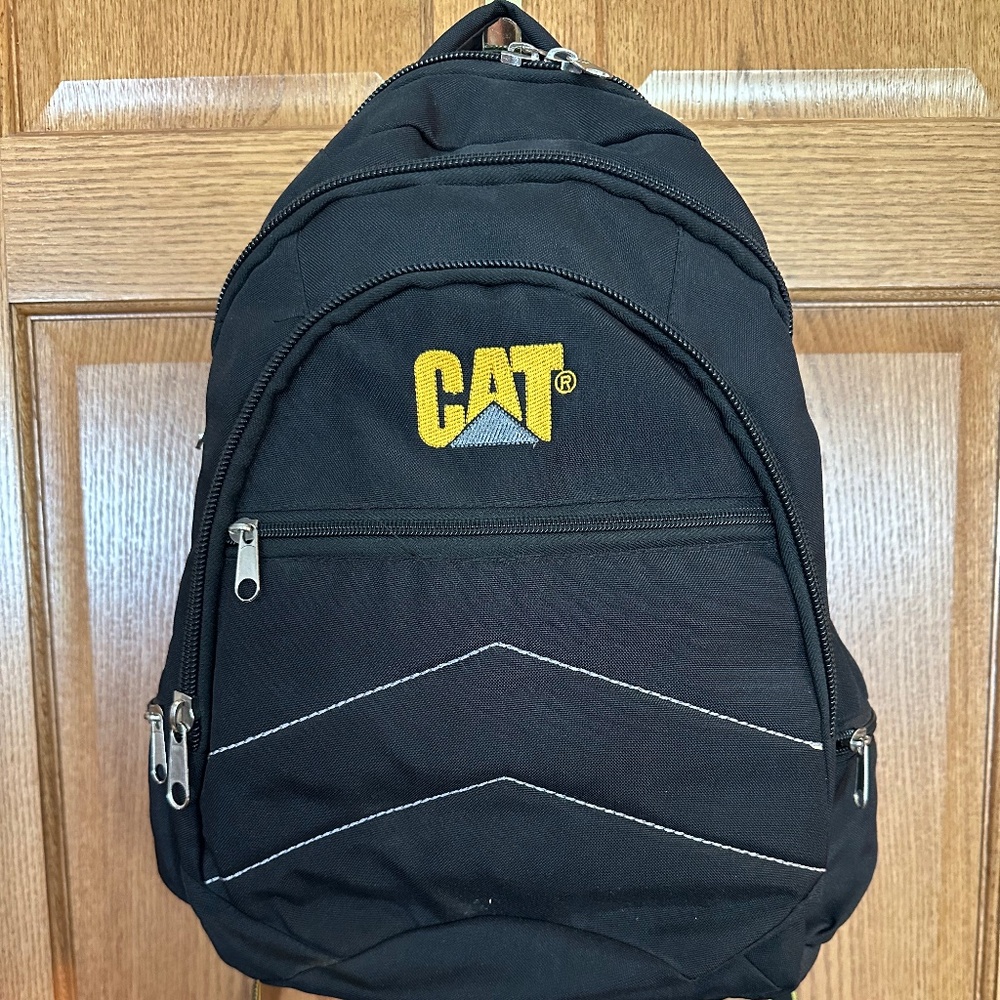 CAT brand black and gold backpack-new without tags